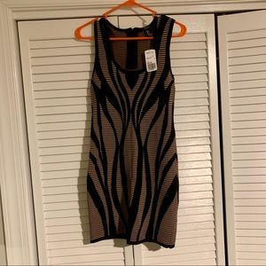 Patterned fitted mini dress. Size L. New with tags